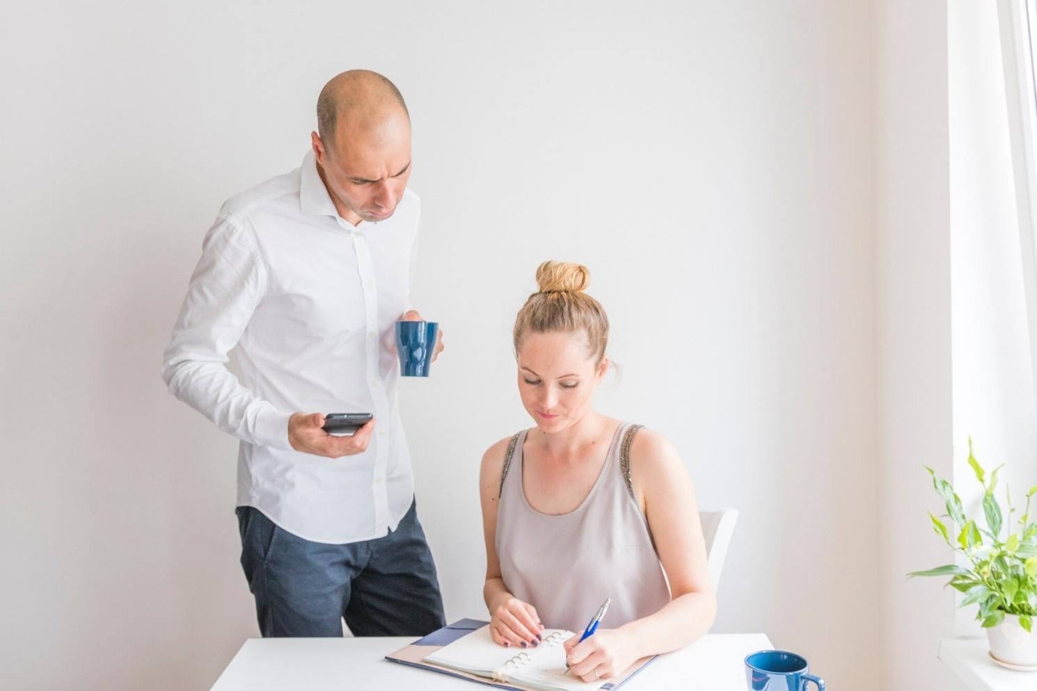 Collaborative software development workspace showing team members working together on code review and pair programming